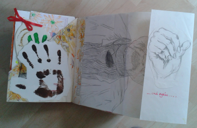 The page unfolds to reveal a sketch of a hand by my daughter and instructions to unfold again.
